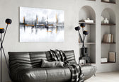 Mirrored-skyline abstract glass wall art in boutique-hotel reception