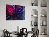 Stage-lit palm-fan cinematic glass wall art over master-bedroom headboard