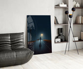 Rain-slick road cinematic glass wall art over modern dining sideboard