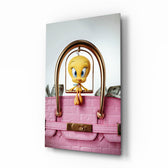 Tweety in pink Birkin cinematic glass wall art over walnut console in designer fashion atelier