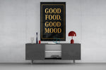 Matte-black gold cinematic glass wall art in light-filled atelier