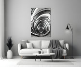 Loop glass wall art styled above a bench in a stairwell