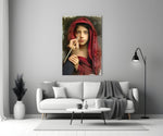 Portrait glass wall art styled above a console in a study