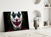 Joker glass wall art styled above a desk in a man's office