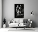 Feather glass wall art styled above a bed in a bedroom