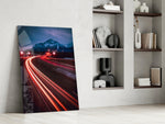Road artwork anchoring a wall with bold kinetic palette