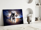 Astronaut glass wall art styled above a desk in a teen room