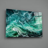 Close-up detail of emerald foam swirling against cyan currents