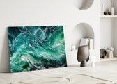 Ocean glass wall art styled above a sofa in a living room