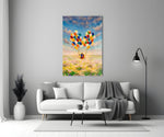 Balloons glass wall art styled above a bed in a child's room