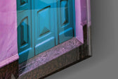 Blue Door panel catching gallery light to reveal its tactile paneling
