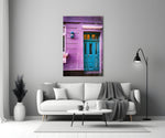 Blue Door glass wall art styled above a sideboard in a sunroom