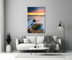 Coast Sunset glass wall art styled above a sofa in a living room