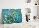 Almond Blossom glass wall art styled above a sofa in a living room