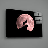 Close-up detail of wolf silhouette against rose-pink supermoon