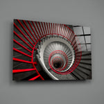 Close-up detail of crimson rails coiling around the helical steps