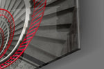 Red Spiral panel catching gallery light to reveal its tactile geometry