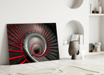 Red Spiral glass wall art styled above a console in a foyer