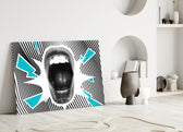 Scream glass wall art styled above a desk in a creative office