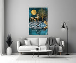 Twin Deer glass wall art styled above a sofa in a living room