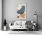 Pebble Stack glass wall art styled above a bed in a bedroom