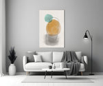 Sun And Moon glass wall art styled above a sofa in a living room