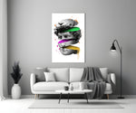 David Slices glass wall art styled above a desk in a creative office