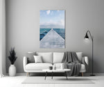 Pier Horizon glass wall art styled above a bed in a bedroom