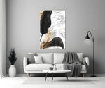 Marble Feathers glass wall art styled above a console in a foyer