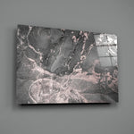 Close-up detail of blush-pink veins threading through charcoal smoke