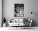 Charcoal Lightning glass wall art styled above a sofa in a living room