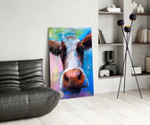 Painted Cow glass print enhancing a dining room with editorial drama