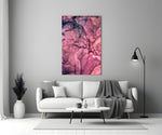 Magenta Bloom glass wall art styled above a sofa in a master bedroom