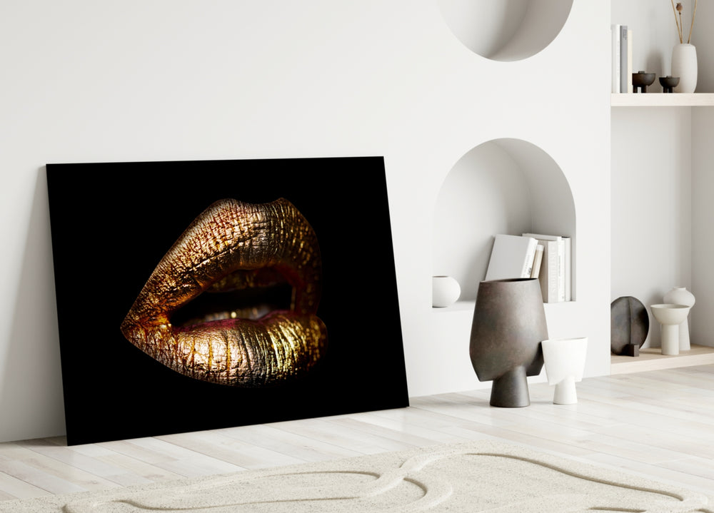 Gold Lips glass wall art styled above a fireplace in a master bedroom