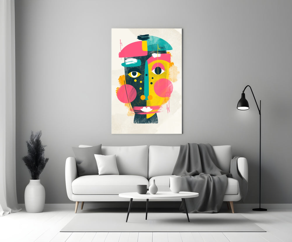 Pop Face glass wall art styled above a sofa in a creative office