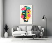 Pop Face glass wall art styled above a sofa in a creative office