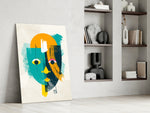 Amber Face artwork anchoring a wall with bold modernist palette