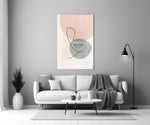 Line Portrait glass wall art styled above a sofa in a master bedroom