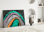 Selmin Arcs glass wall art styled above a sofa in a creative office
