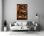 Orange Stairs glass wall art styled above a chair in a hallway