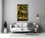 Yellow Stairs glass wall art styled above a sofa in a hallway