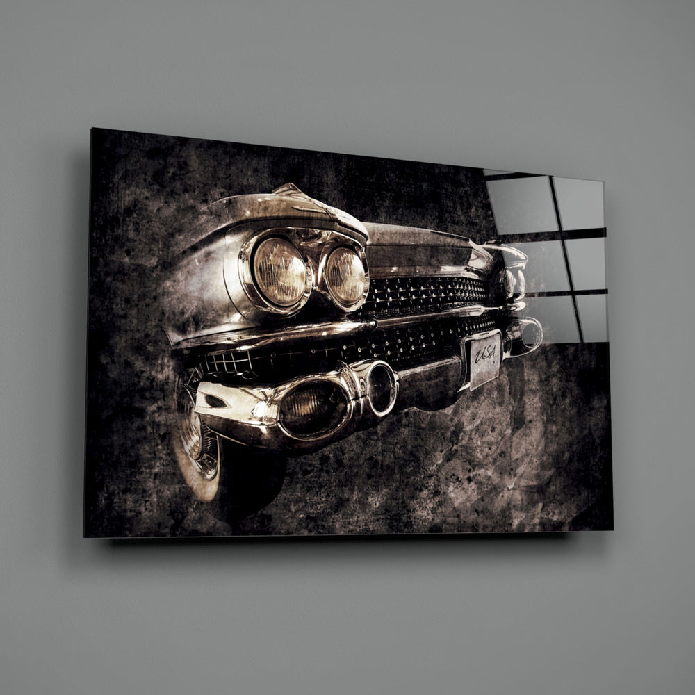 Vintage Cadillac close-up showing chrome dual headlights and toothed grille