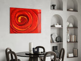 Red Vortex glass print enhancing a living room with cinematic drama