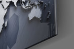 Silver World Map panel catching window light to reveal its tactile relief