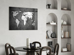 Grunge World Map glass print enhancing a gaming room with cinematic drama