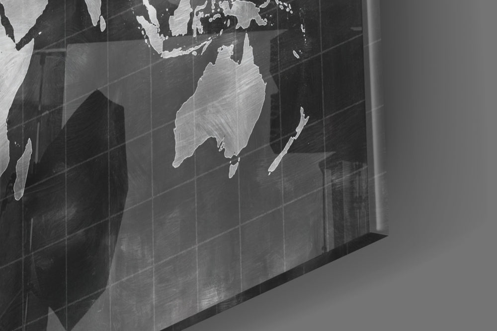 Chalkboard Map panel catching brass-light to reveal its tactile mark