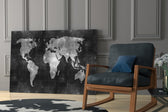 Chalkboard Map artwork anchoring a wall with moody scholarly palette