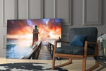 Sunset Lighthouse artwork anchoring a wall with coastal dramatic palette