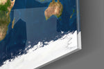 Satellite Earth panel catching window light to reveal its tactile texture