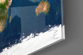 Satellite Earth panel catching window light to reveal its tactile texture